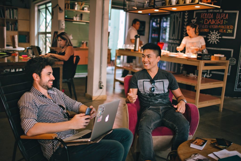 Two men talking in a casual workspace